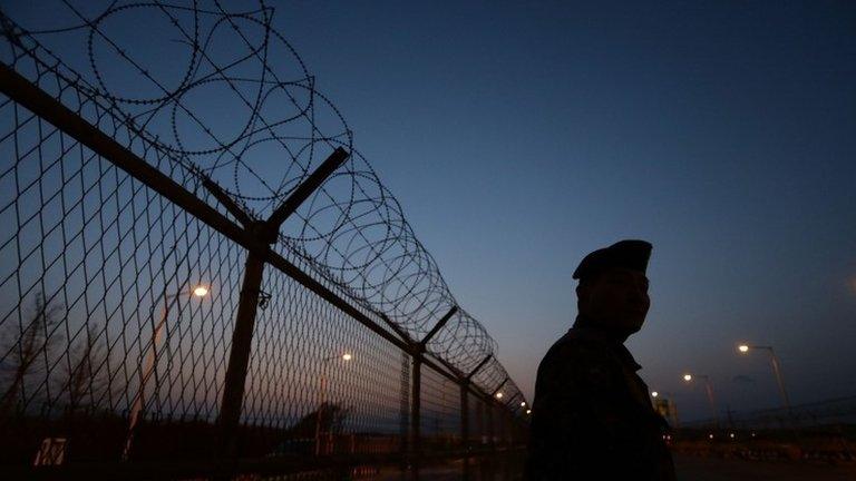 A South Korean soldier patrols the road connecting South and North Korea at the Unification Bridge, near the Demilitarized zone (DMZ) separating South and North Korea on January 9, 2018