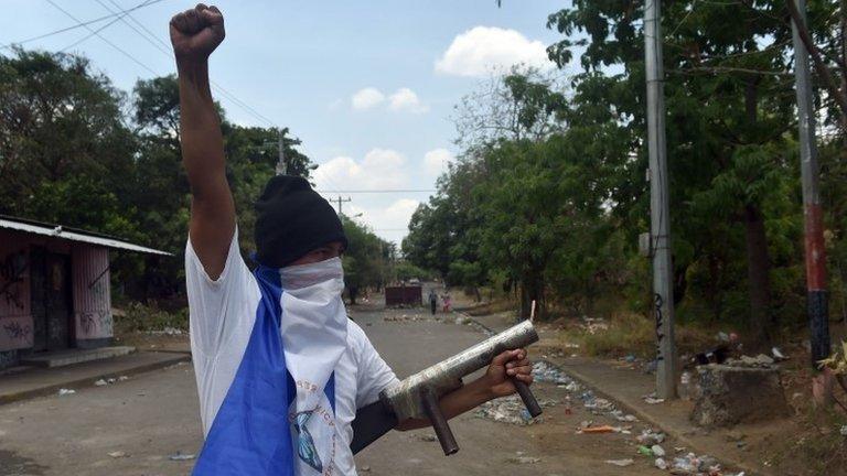 A student holds a hand-made mortar during protests against the government"s reforms in the Institute of Social Security (INSS) in Managua on April 22, 2018.