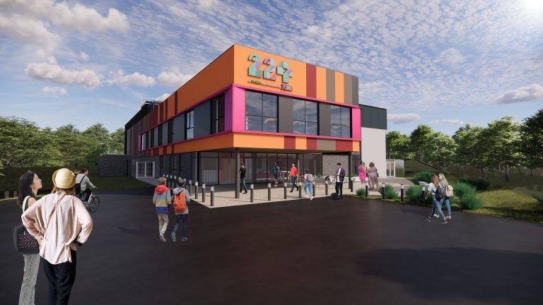 A computer generated image of the youth centre. It is a large rectangular building in pink, orange and red, with lots of windows and the numbers 224 at the top. The entrance is surrounded by light-up bollards. 