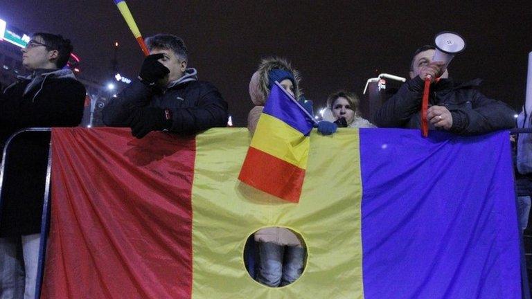 Protesters with Romanian national flags in Bucharest. Photo: 4 February 2017