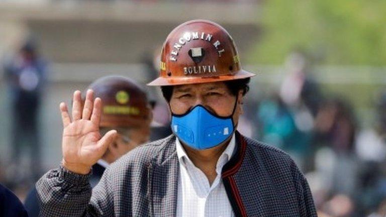 Former Bolivian President Evo Morales waves as he returns to his home country from exile in Argentina, at the border town of Villazon, Bolivia, November 9, 2020.