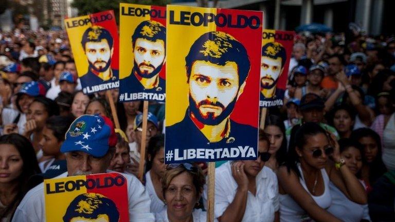 Demonstrators hold placards with the image of Venezuelan leader Leopoldo Lopez during the march entitled "A shout for freedom" to promote an amnesty law that allows the release of jailed members of the Venezuelan opposition, in Caracas, Venezuela, 20 February 2016.