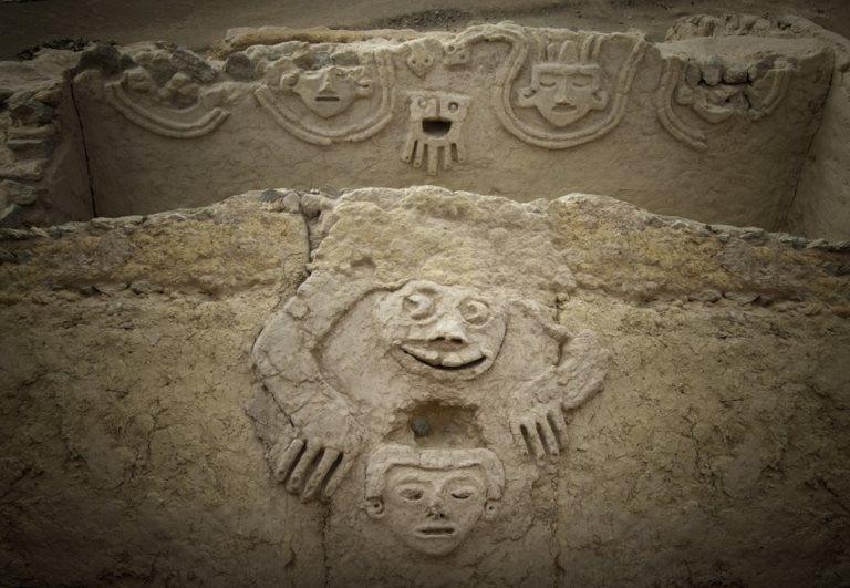 An undated handout photo made available by Archaeological Area Caral shows a humanised toad and an anthropomorphic head, discovered in one of the buildings of the civilization of Caral, north of Lima