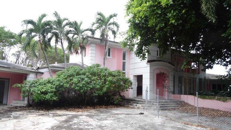 The entrance of a house that used to belong to notorious Colombian drug lord Pablo Escobar is pictured on January 13, 2016, in Miami Beach, FL.