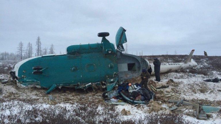 Crashed helicopter lying on a field