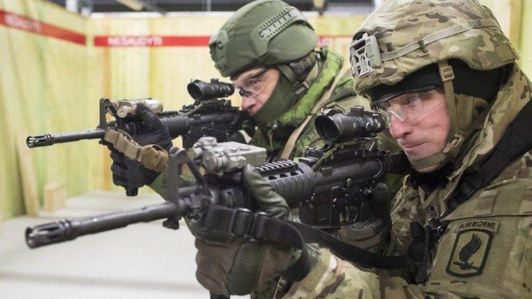 A US and Lithuanian soldier take part in an exercise in Lithuania, 2 February 2017