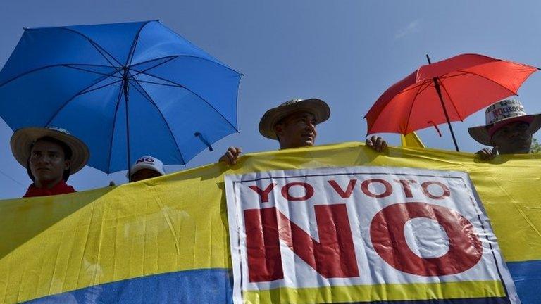 Followers of the opposition to the peace process between the Colombian government and the FARC guerrillas attend a speech by former President Alvaro Uribe Velez (out of frame) during a demonstration, on September 26, 2016, in Cartagena, .