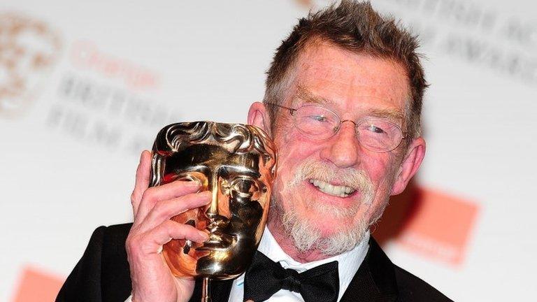 Sir John Hurt with Bafta award