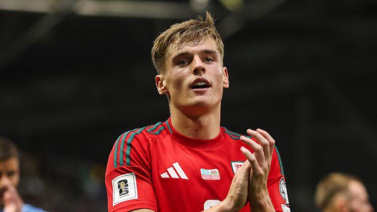 Wales defender Dylan Lawlor applauds