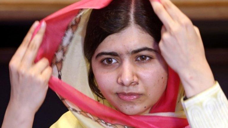 Nobel Peace Prize laureate Malala Yousafzai adjusts her scarf as she speaks during an interview with Reuters at a local hotel in Islamabad, Pakistan, March 30, 2018.