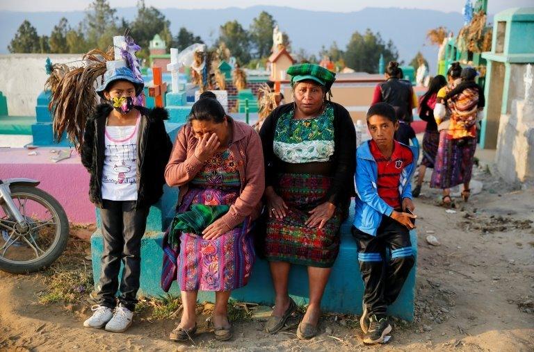 A woman reacts during the funeral of Rivaldo Jimenez Ramirez, Santa Cristina Garcia and Ivan Gudiel Pablo, migrants killed in the Mexican state of Tamaulipas while trying to reach the U.S., in Comitancillo, Guatemala, March 14, 2021.