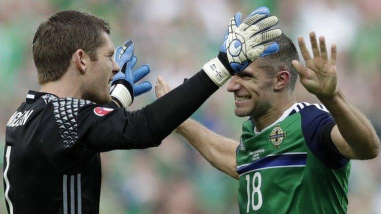 NI goalkeeper Michael McGovern and defender Aaron Hughes celebrate their win over Ukraine