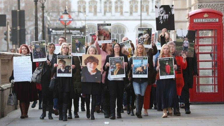 Families holding banners