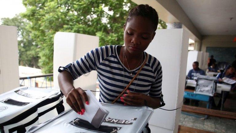 A woman casts her ballot at a polling station, as Haiti holds a long-delayed presidential election, in Port-au-Prince, Haiti, November 20, 2016