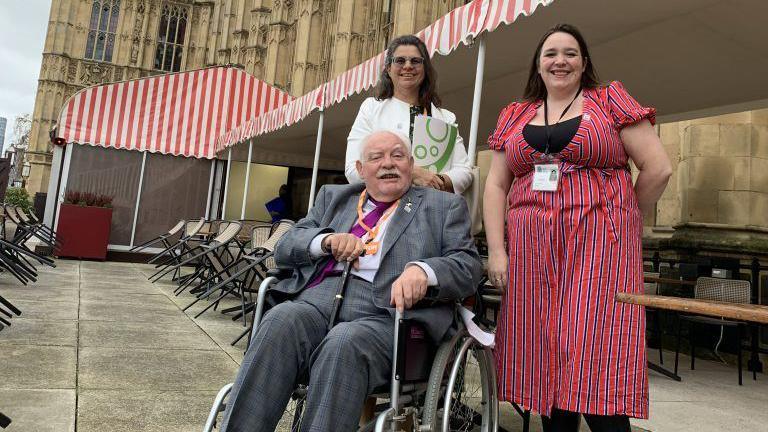 Robert Taylor with Meirelle Frost of the Sunlight Trust and trustee Lia Mandaracas on the terrace of the House of Commons.