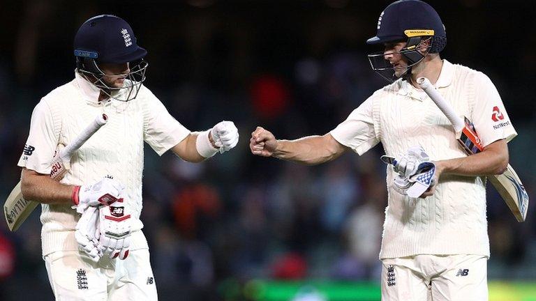 Joe Root and Chris Woakes will resume England's innings on Wednesday