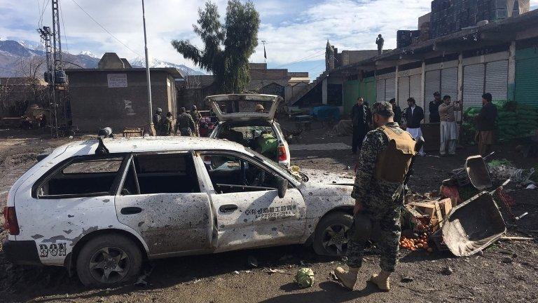 Pakistani security officials inspect the bomb explosion site at a vegetable market in Parachinar city, the capital of Kurram tribal district on the Afghan border on January 21, 2017.