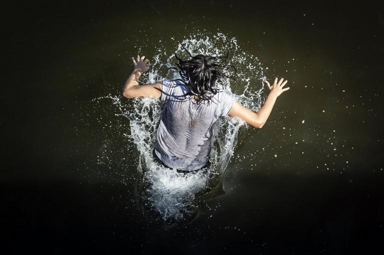 Woman jumps into sea