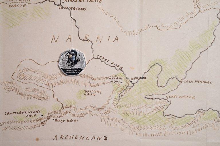 The coin on a map of Narnia.