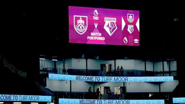 Turf Moor scoreboard displaying message that Burnley against Watford has been postponed