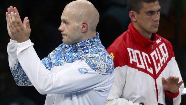 Kazakhstan's Vassiliy Levit (left) was cheered on the podium while Russian winner Evgeny Tishchenko was jeered