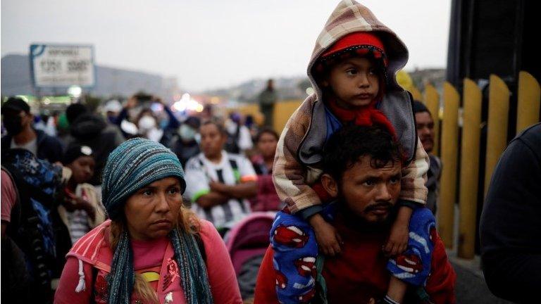 Members of the migrant caravan are seen as police prevent them from passing on the Mexico-Puebla highway, in Los Reyes La Paz, Mexico, December 12, 2021