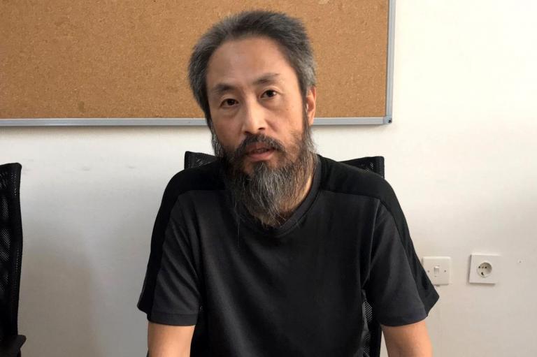 Japanese journalist Jumpei Yasuda heavily bearded in an immigration centre in Turkey