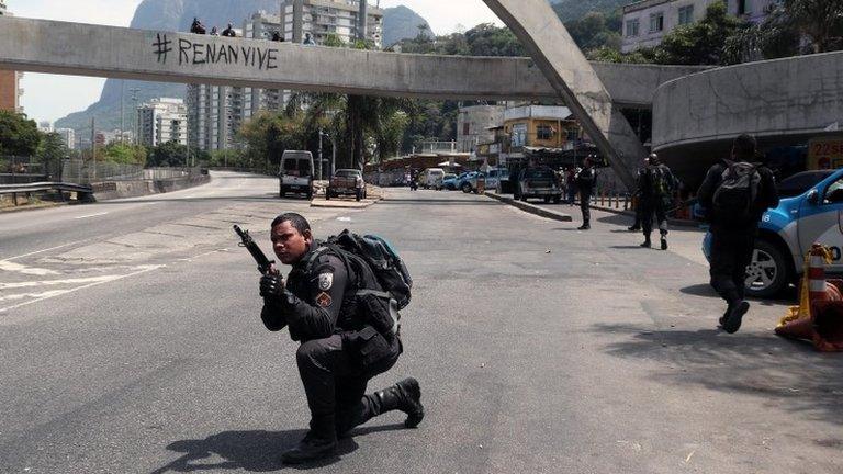 Military police officers participate in an operation at the Rocinha favela in Rio de Janeiro, Brazil, 22 September 2017.