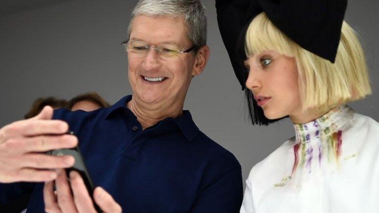 Tim Cook and Maddie Ziegler