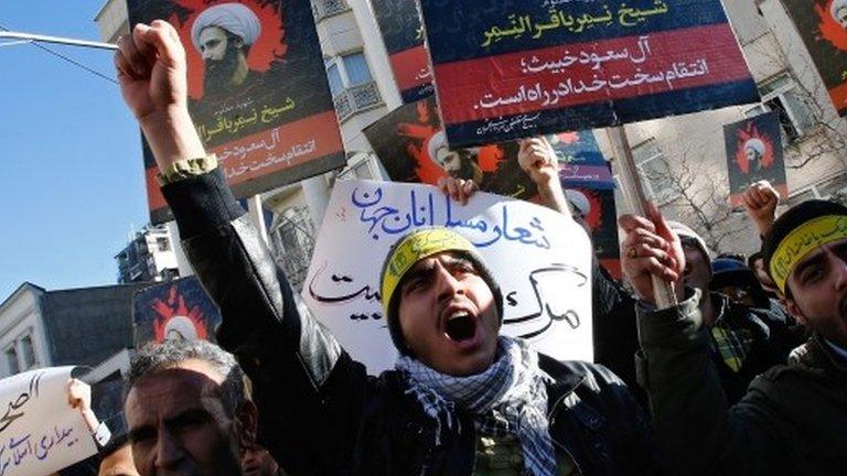 Iranian protesters hold placards of Nimr al-Nimr at a demonstration near Saudi embassy in Tehran (03/01/16)