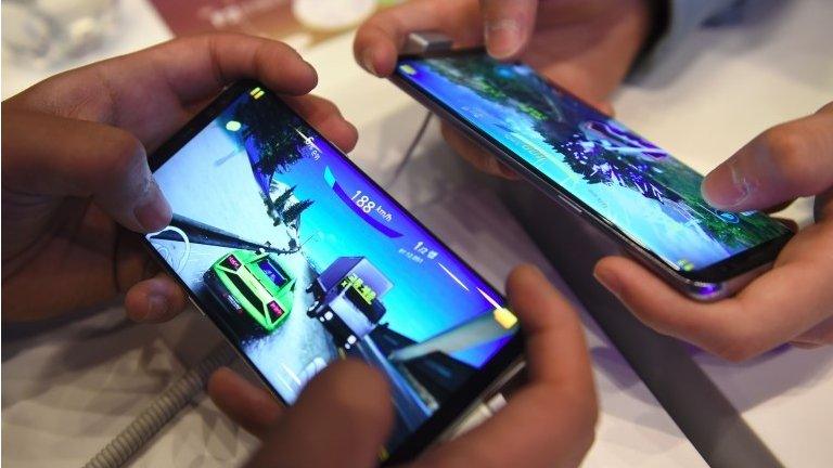 South Korean students play mobile games on Samsung Galaxy S8 smartphones