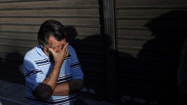 Pensioners who do not own ATM cards line up outside a bank branch to withdraw part of their pensions as a result of capital controls imposed by the Greek government, in Peristeri suburb west of Athens, Greece, 01 July 2015.