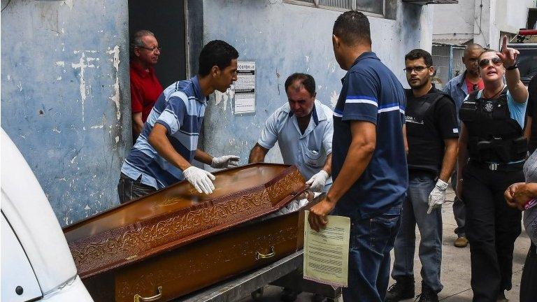 A relative makes the identifiaction of a body at the Institute of Legal Medicine in Vitoria, Espirito Santo, Brazil, 07 February 2017,