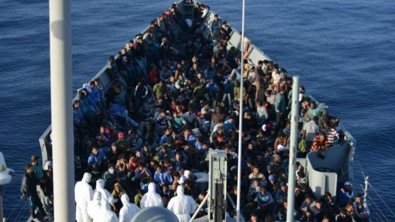 A picture provided by Spanish Ministry of Defence on 5 November, 2015 shows migrants rescued off the coast of Libya gathered on the "Canarias" frigate.