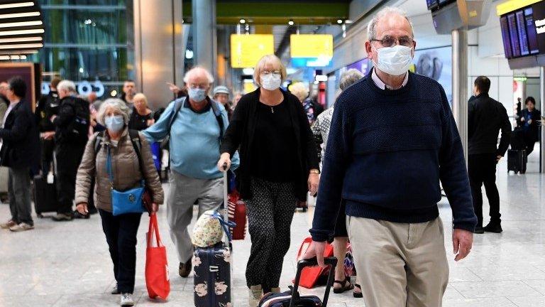 British tourists who were aboard the cruise ship Braemar arrive back in UK from Cuba at Heathrow Airport in London on 19 March 2020