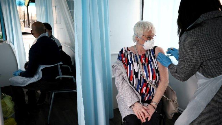 A woman getting a Covid vaccine in London