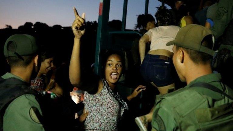 Detainees get on a truck after they were caught looting during an ongoing blackout in Caracas, Venezuela March 10, 2019.