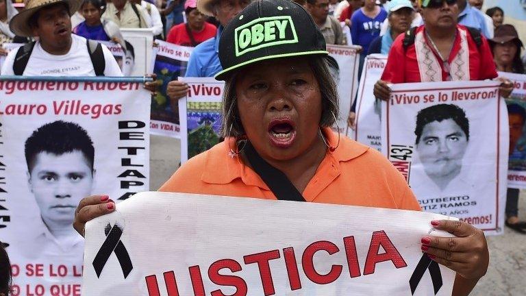 Relatives and friends of the 43 missing students take part in a demonstration in Iguala to commemorate the first anniversary of their disappearance. 27/09/2015)