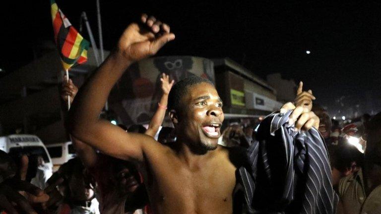 Zimbabweans celebrate after President Robert Mugabe resigns in Harare, Zimbabwe