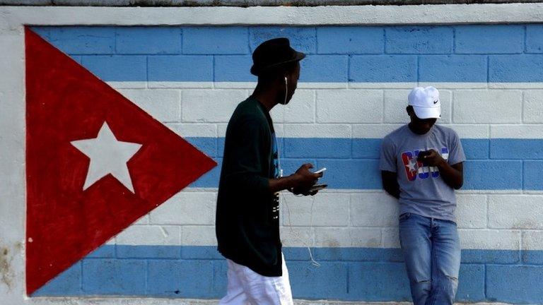 A teenager looks at his mobile phone as he connects to the internet in downtown Havana, following the announcement of the death of the Cuban revolutionary leader Castro, 27 Nov 16