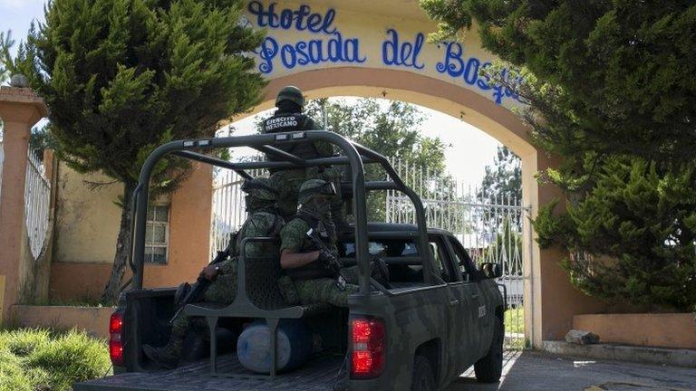 Mexican soldiers guard the funeral of Ocampo municipality Mayor and candidate for the Democratic Revolutionary Party (PRD), Fernando Angeles, in Ocampo, Michoacan State, Mexico, on June 21, 2018.