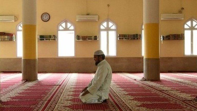 A Muslim devotee attends a prayer on the first day of the holy month of Ramadan during a government-imposed nationwide lockdown in Kathmandu