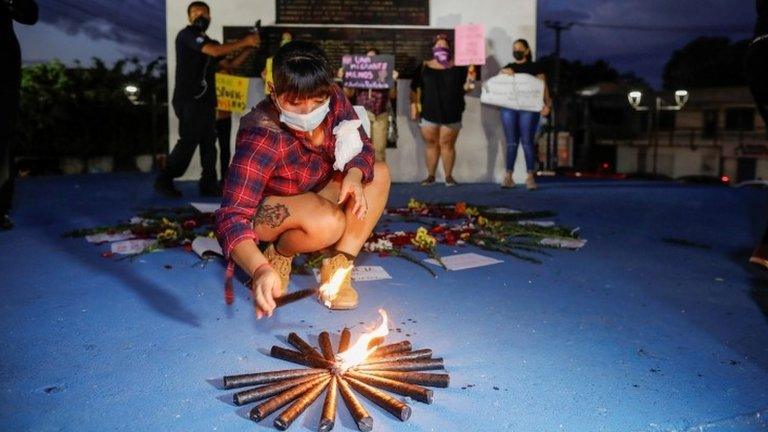 A woman takes part in a protest against the murder of Victoria Salazar Arriaza, a Salvadoran woman who died in Mexican police custody, in San Salvador, El Salvador March 29, 2021.