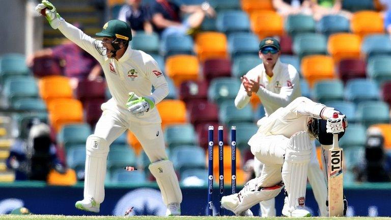 Moeen Ali is stumped by Tim Paine