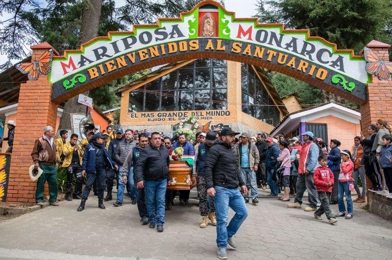 People carry the coffin with the remains of Mexican environmentalist Homero Gomez, during his funeral procession in El Rosario village, Ocampo municipality, Michoacan State, Mexico, on January 30, 2020.