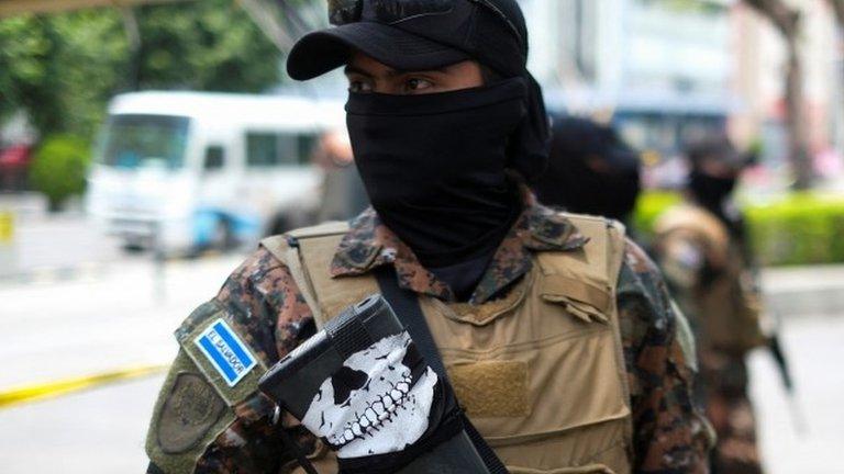 A soldier stands in a park after a patrol in downtown San Salvador after El Salvador"s Congress extended emergency powers to fight gangs for one more month, in San Salvador, El Salvador, April 25, 2022.