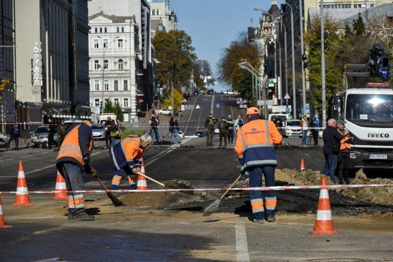 workers clear up attack debris