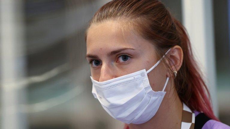 Krystsina Tsimanouskaya escorted at Haneda airport in Tokyo