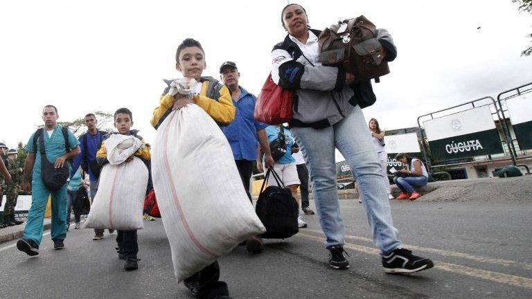 Venezuelans cross the Simon Bolivar bridge linking San Antonio del Tachira, in Venezuela with Cucuta, Colombia, to buy basic supplies