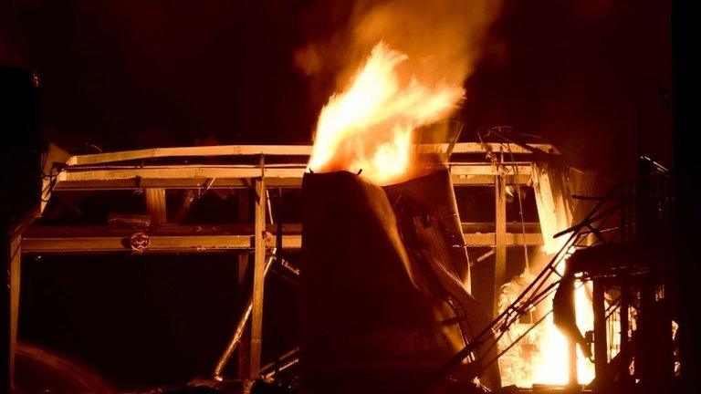 Fire burns at a plant of Shandong Runxing Chemical Technology Co after an explosion in Zibo, Shandong Province 23/08/2015